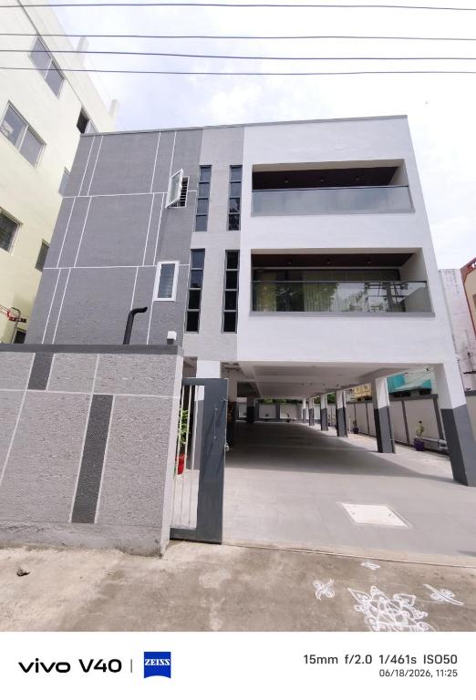 a building with solar panels on the side of it at Velmora Luxe Residences in Madurai
