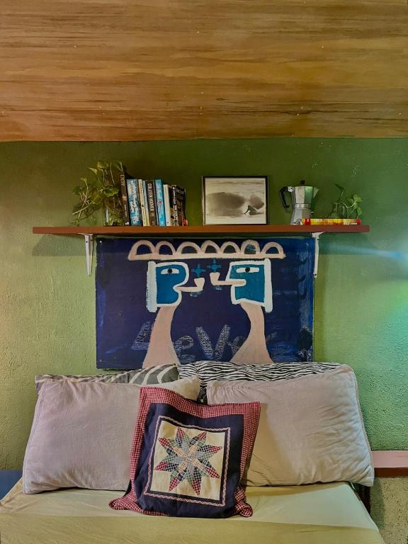 a headboard of a bed with a shelf above it at The Artist House in Burgos