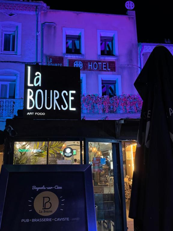 a sign for a la bounce hotel in front of a building at La Bourse in Bagnols-sur-Cèze