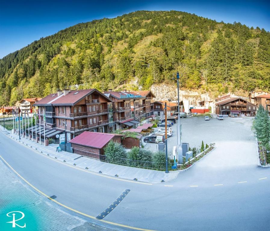 an aerial view of a resort with a mountain at Royal Uzungol Hotel&Spa in Uzungöl
