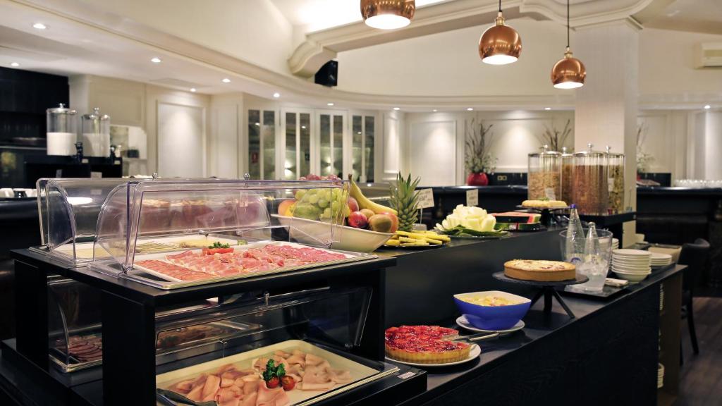 a buffet line with many different types of food at Arc La Rambla in Barcelona