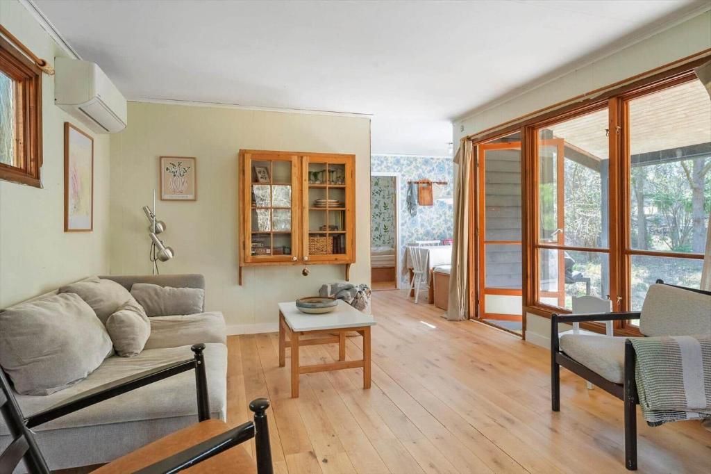 a living room with a couch and a table at 2036-Stege-Solvgranen-16 in Stege