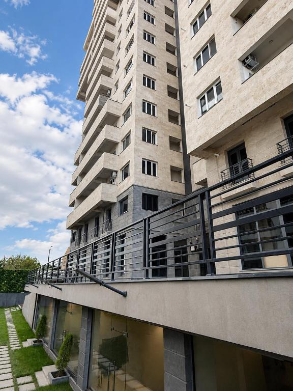 a large apartment building with a balcony at White Residency in Yerevan