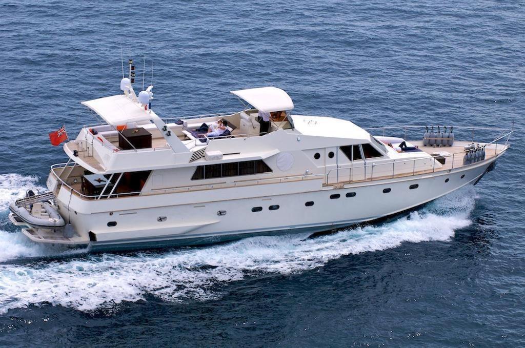 a white boat on the water in the ocean at Yacht Laetitia Delta in Fréjus