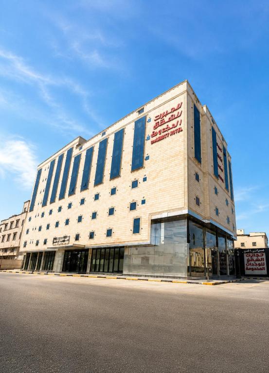 a large building on the side of a street at Lambert ApartHotel in Jeddah