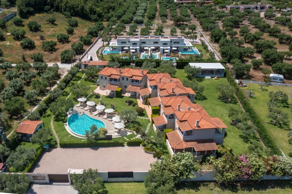 an aerial view of a house with a swimming pool at Kassandra Villas in Hanioti