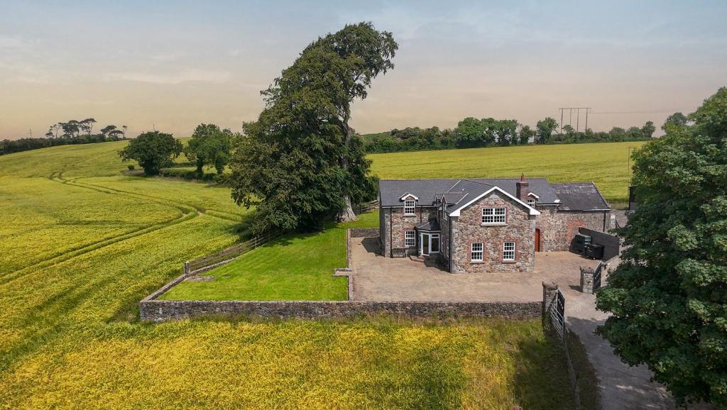 an aerial view of a stone house in a field at Stone House , Boyne Valley Views in Donore