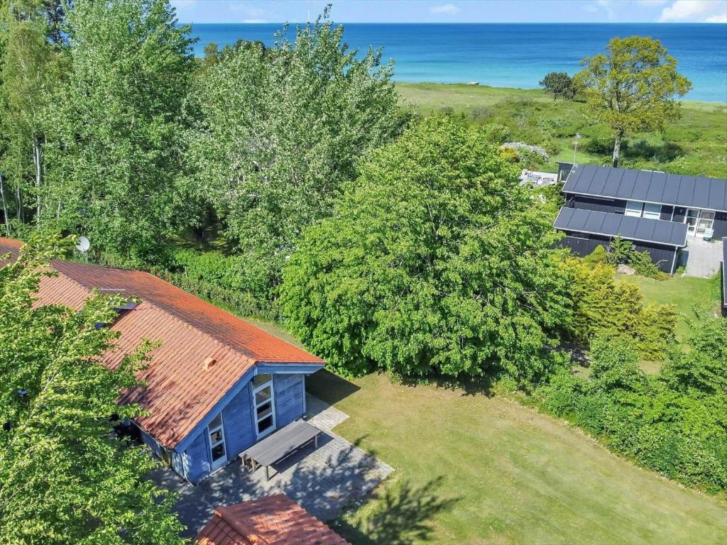an overhead view of a house with trees and a building at 11806-Nykobing-Sj-Klintegarden-1 in Klint