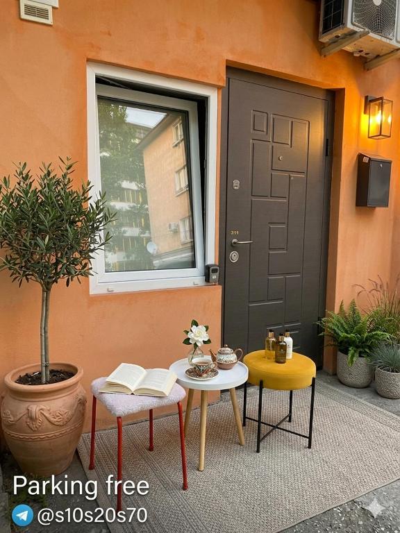 a patio with a table and two chairs and a door at 31 August 1989 N 59 Hotel apart in Chişinău