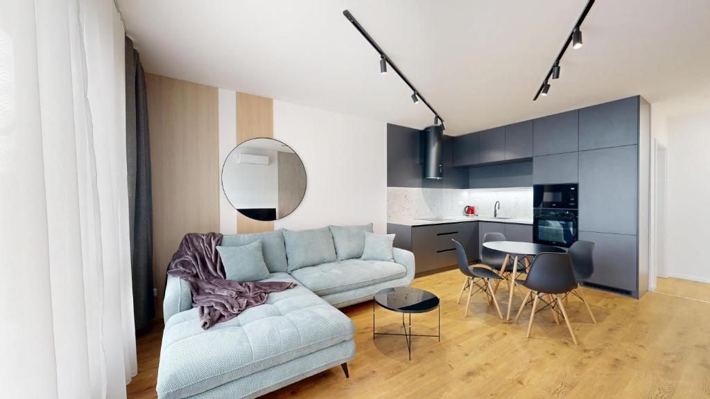a living room with a couch and a table at Candy 3 in Trnava
