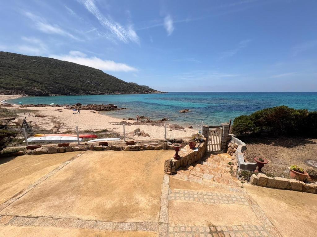 a view of a beach with the ocean at Villa d'exception sur la plage - Tizzano in Sartène