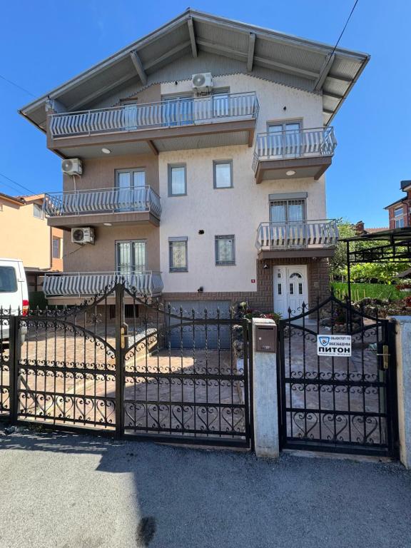 a building with a gate in front of it at DrimResidence in Struga