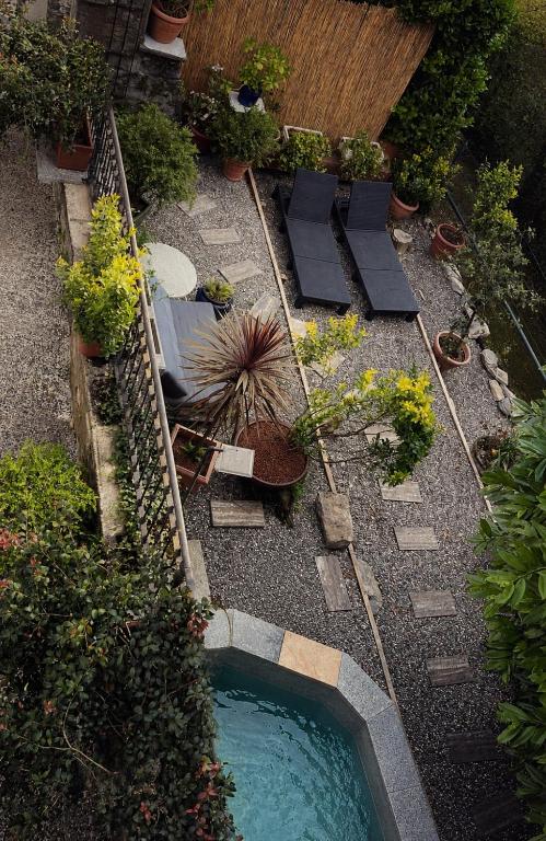 an aerial view of a garden with a swimming pool at Monastero Retreat - Villa con SPA in Lanzo dʼIntelvi