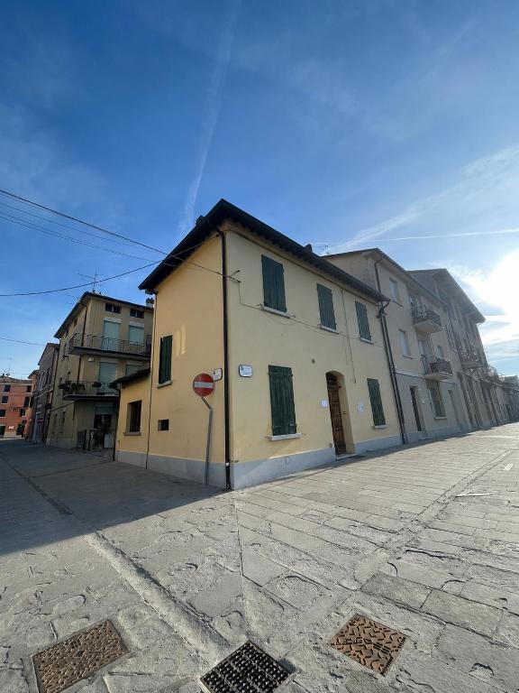 a building on the side of a street at Riolo Terme Camere in Riolo Terme