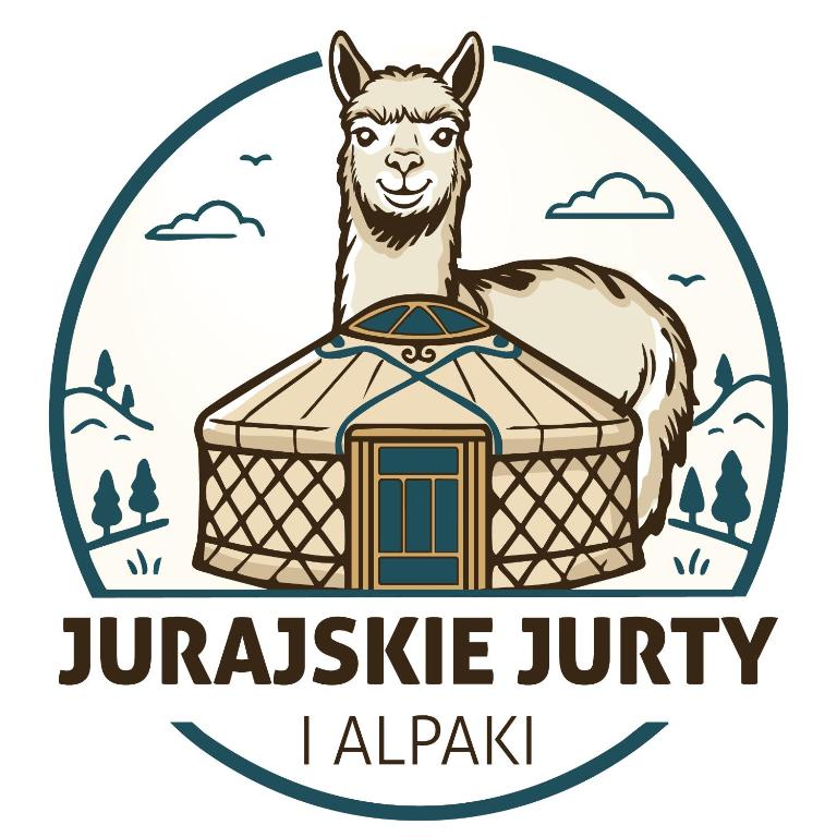 a llama standing next to a jurassic junkykykykyky at Jurajskie Jurty in Golczowice