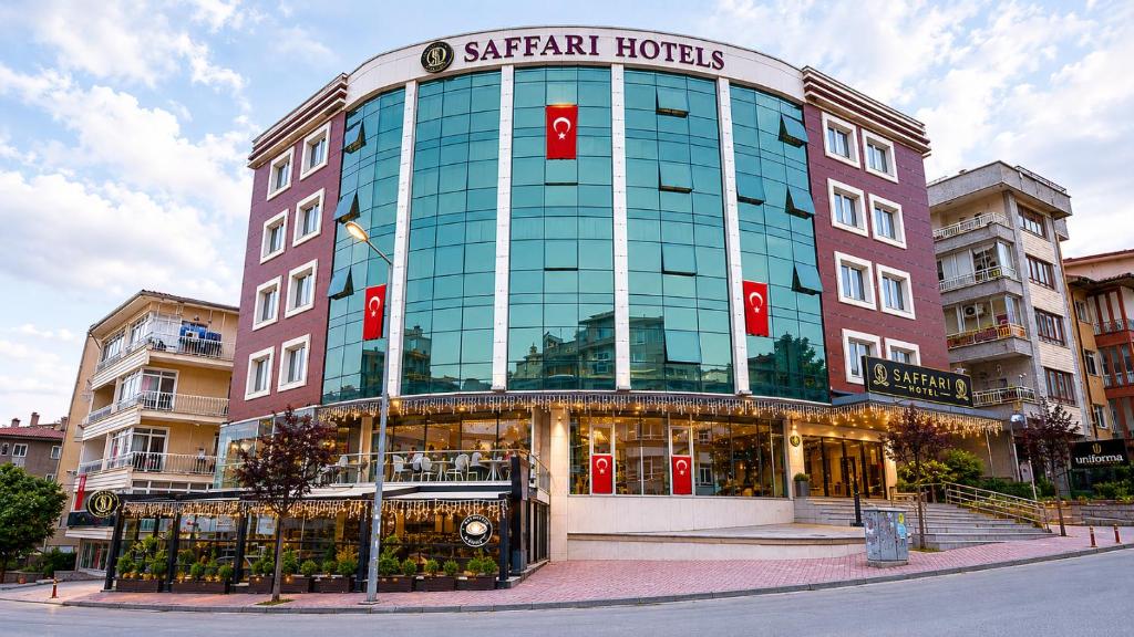 a large building with a sign on top of it at saffari otel in Ankara