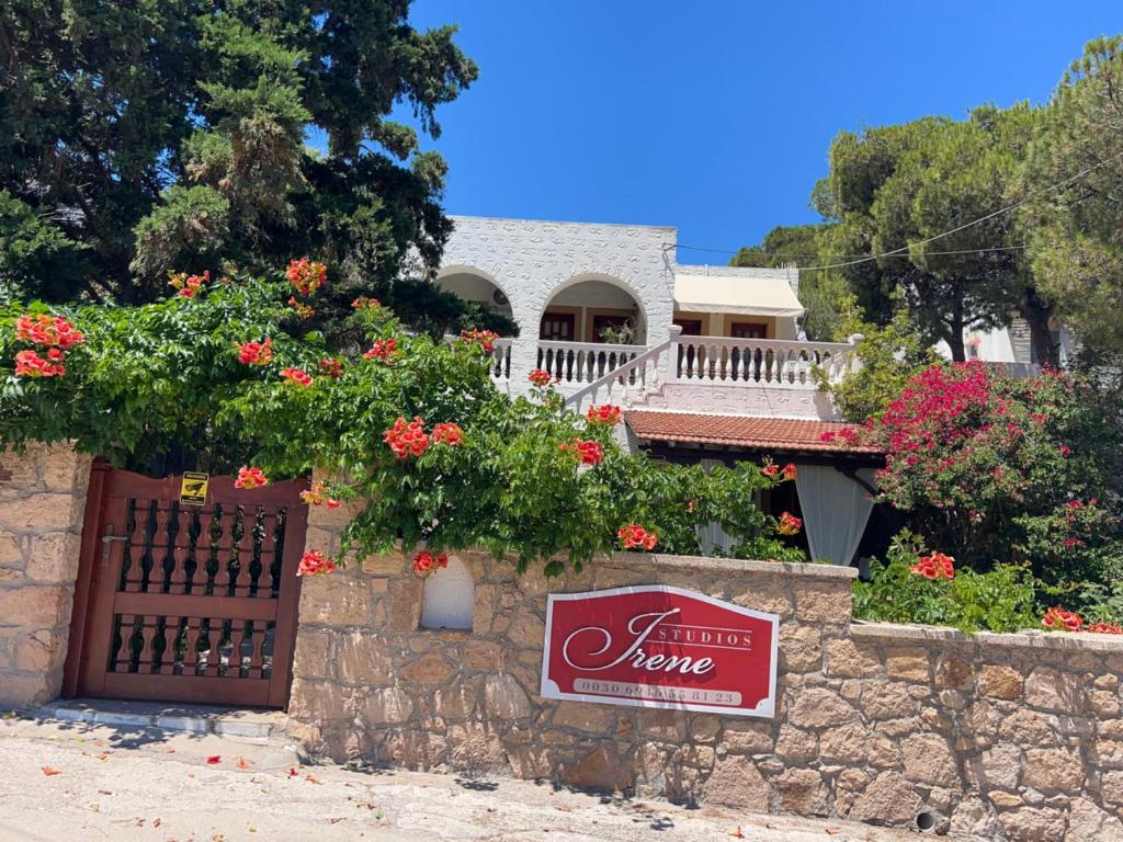 a house with a sign that reads i hate home at Irene Studios Patmos in Skala
