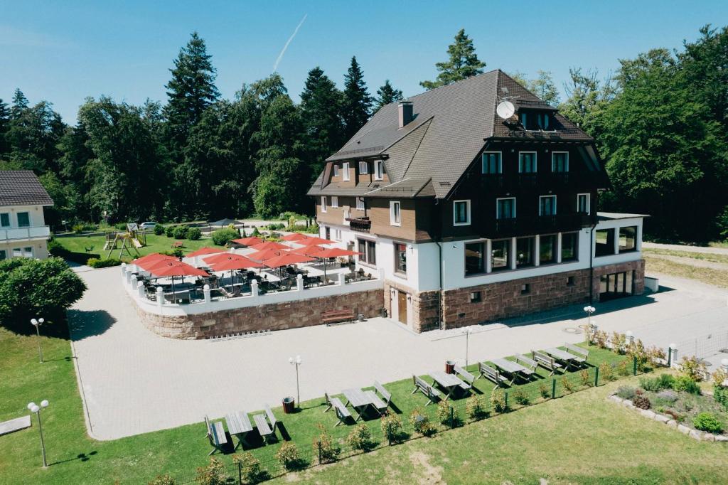 an aerial view of a large house with tables and chairs at EDELFUCHS Rote-Lache in Forbach