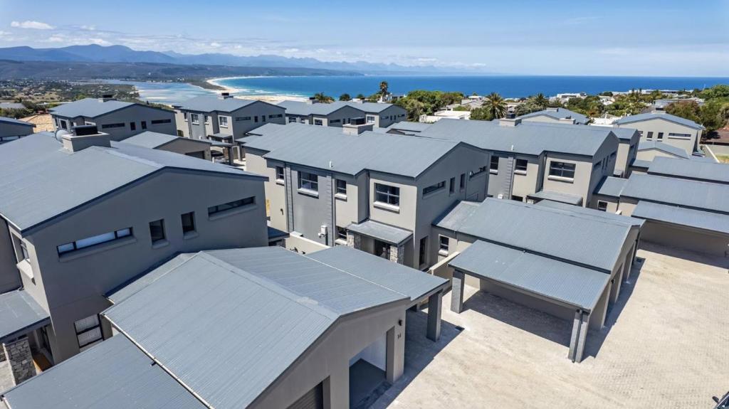 an aerial view of houses and the ocean at My Plett, Your Plett in Plettenberg Bay