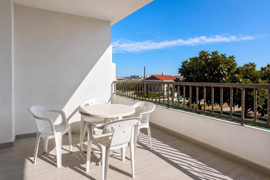 a balcony with a table and chairs and a view at TARONGERS 7 in Peniscola