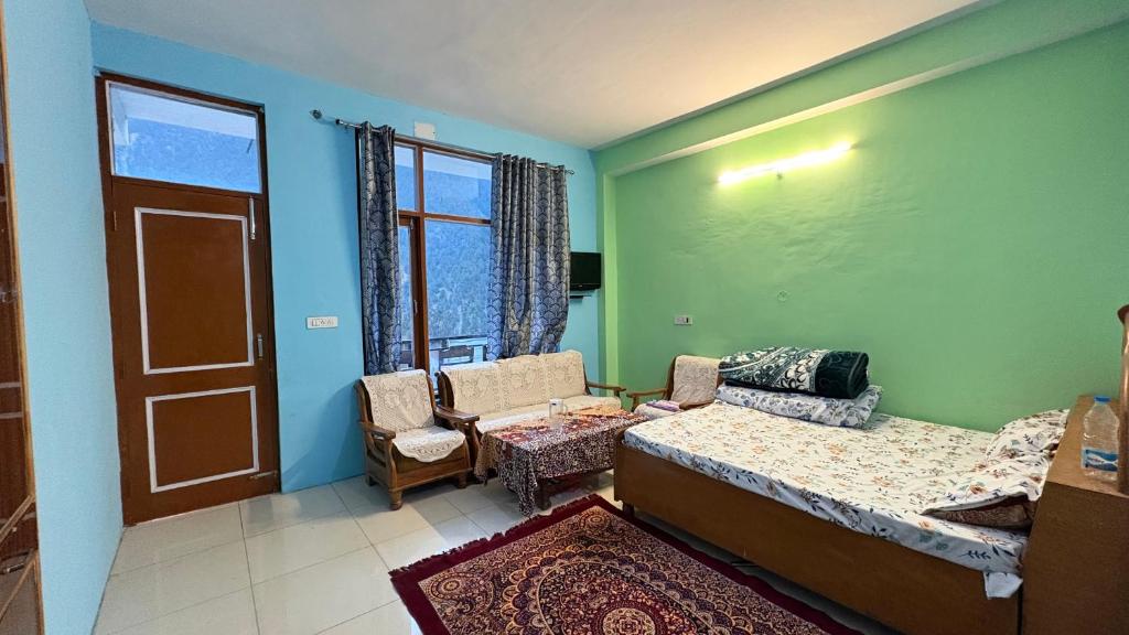 a bedroom with a bed and a chair and a window at The Raulane Homestay in Kalpa