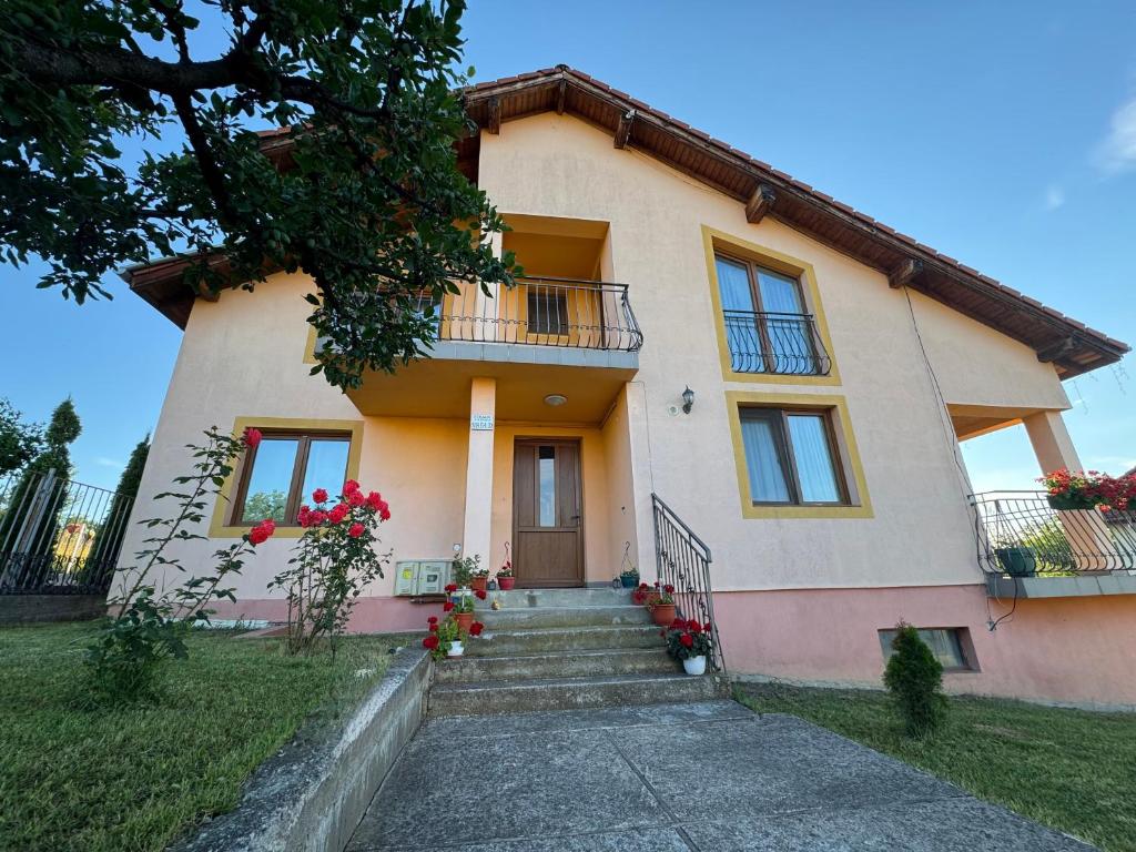 a house with a staircase in front of it at Casa DaLi in Sibiu