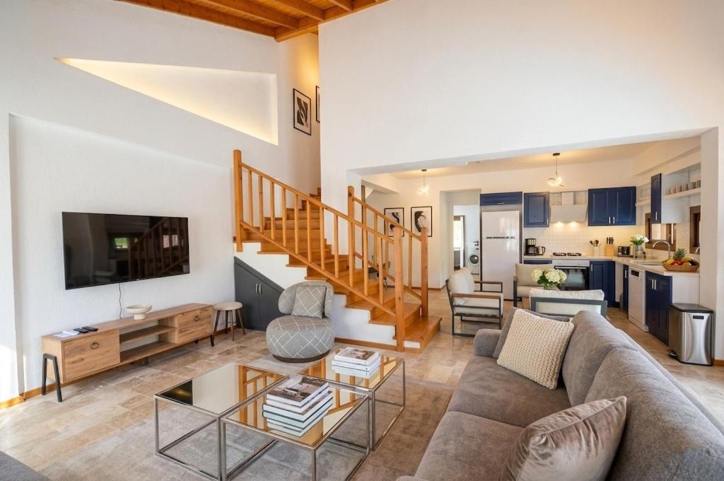 a living room with a couch and a table at Villa Nature in Kırıkyayla