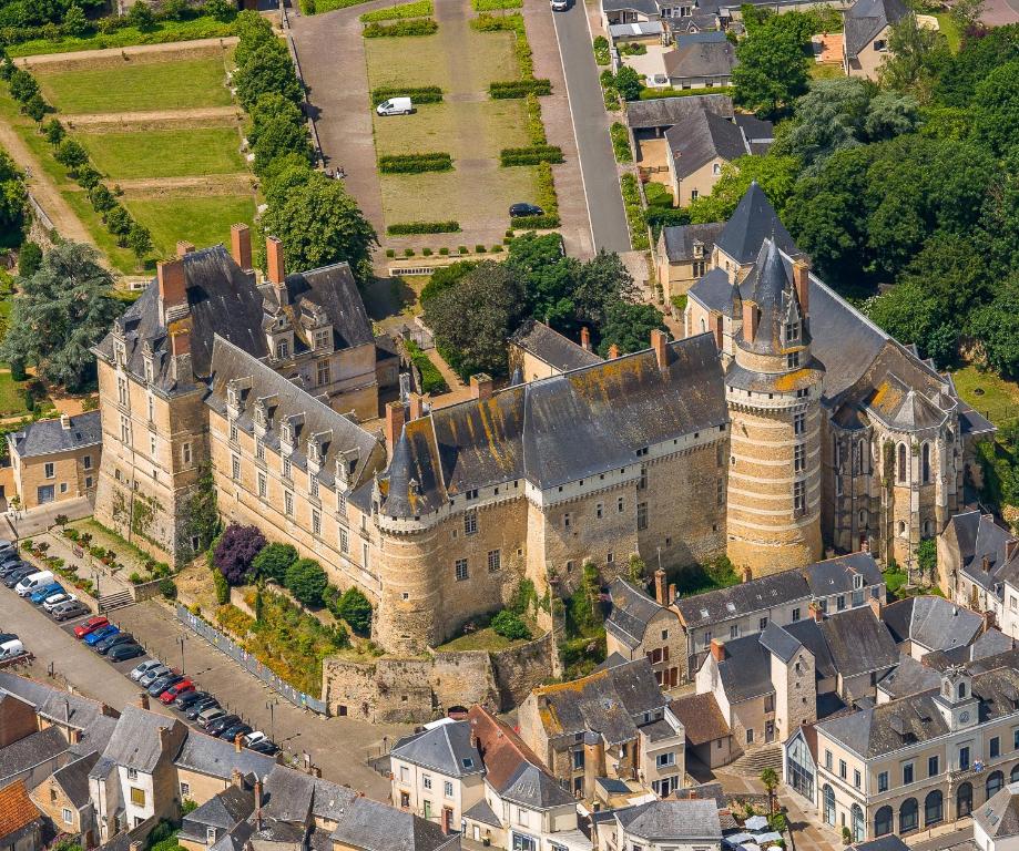 an aerial view of a castle in a city at Chateau de Durtal in Durtal