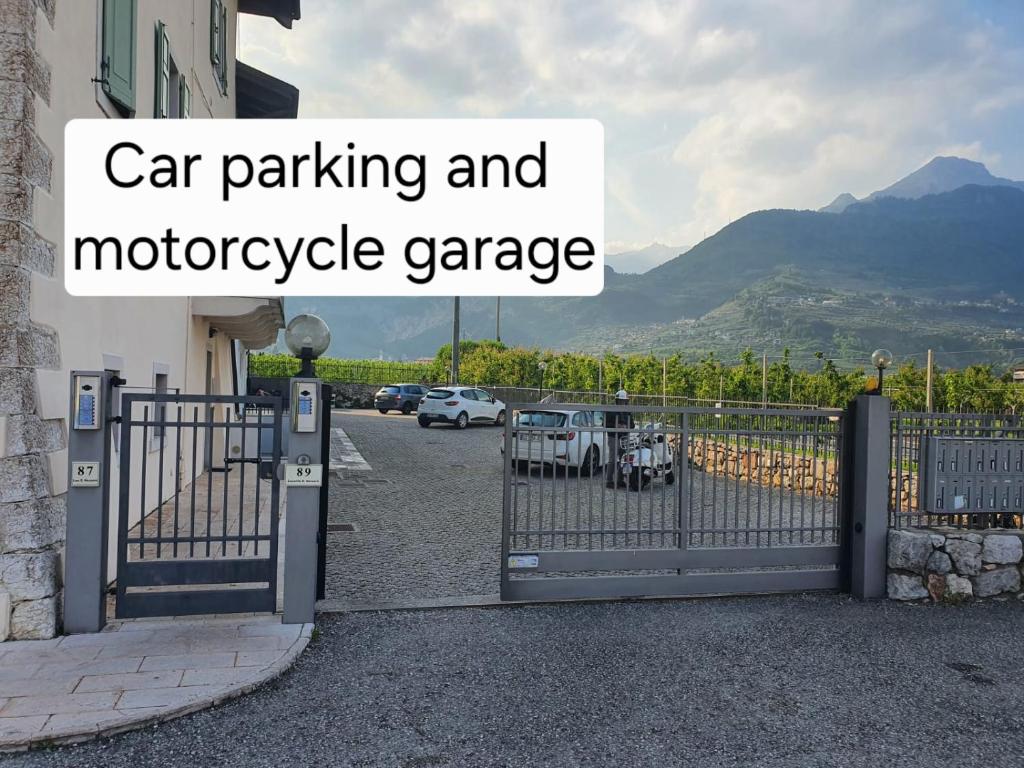 a gate to a car parking and motorcycle garage at GARDAINN La CASCINA in Riva del Garda