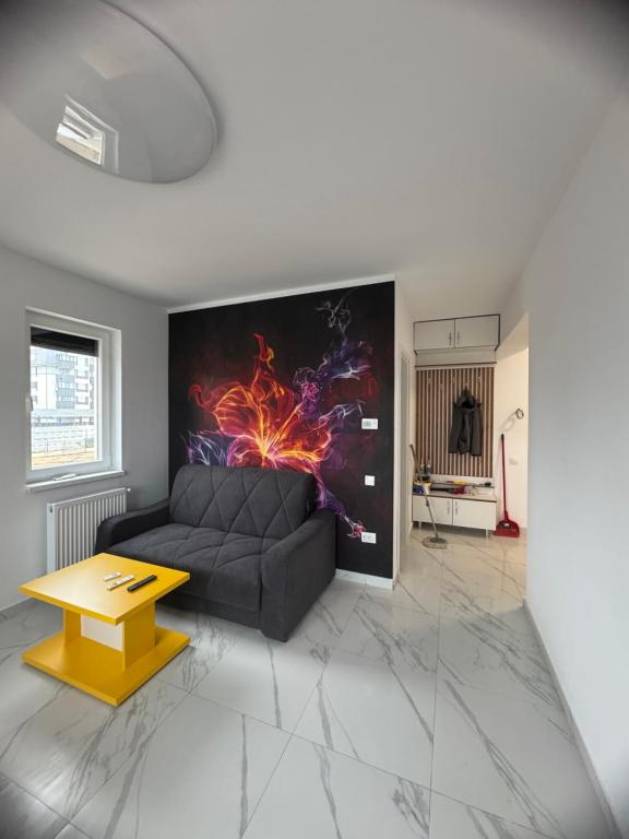 a living room with a couch and a table at Studio Militari Residence - MR1 in Chiajna