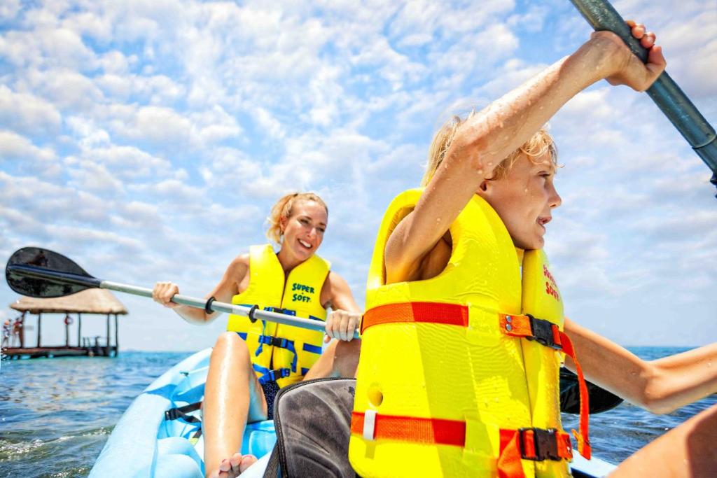 two women in life jackets on a boat in the water at Holiday Inn Club Vacations The Royal Cancun All Inclusive in Cancún