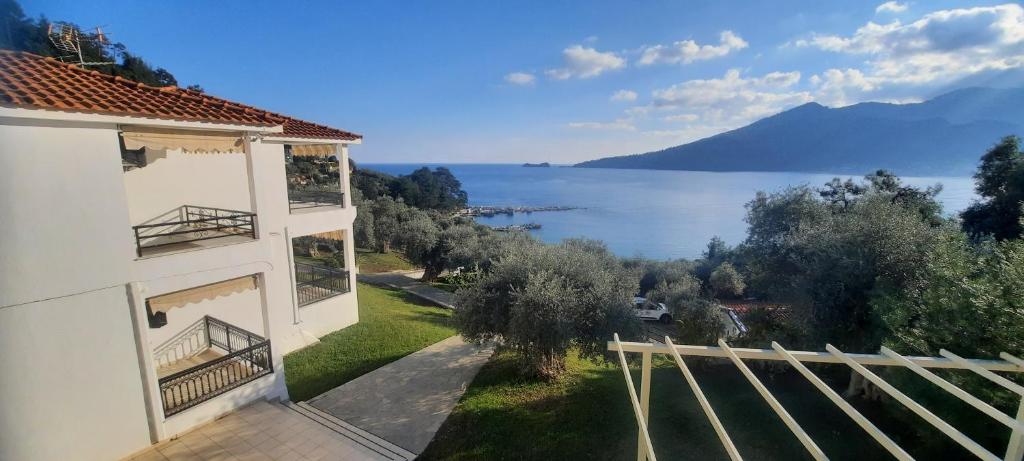 a house with a view of the water at Namastekala Holidays Studios in Chrysi Ammoudia