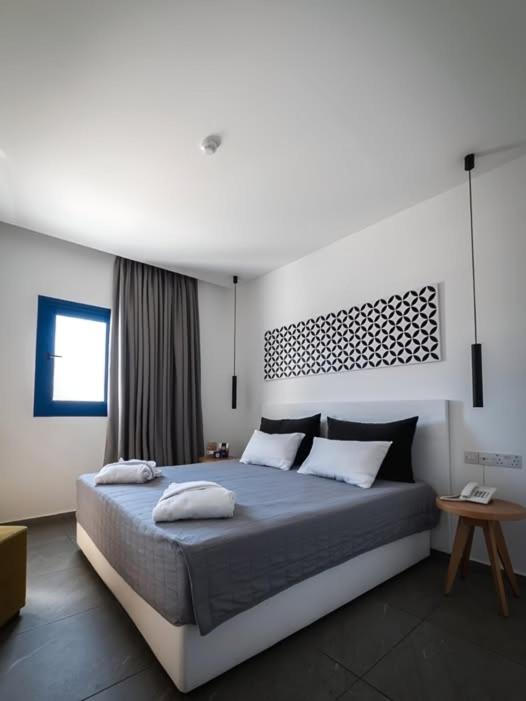 a bedroom with a large bed with pillows on it at Darshan Stay in Trichūr
