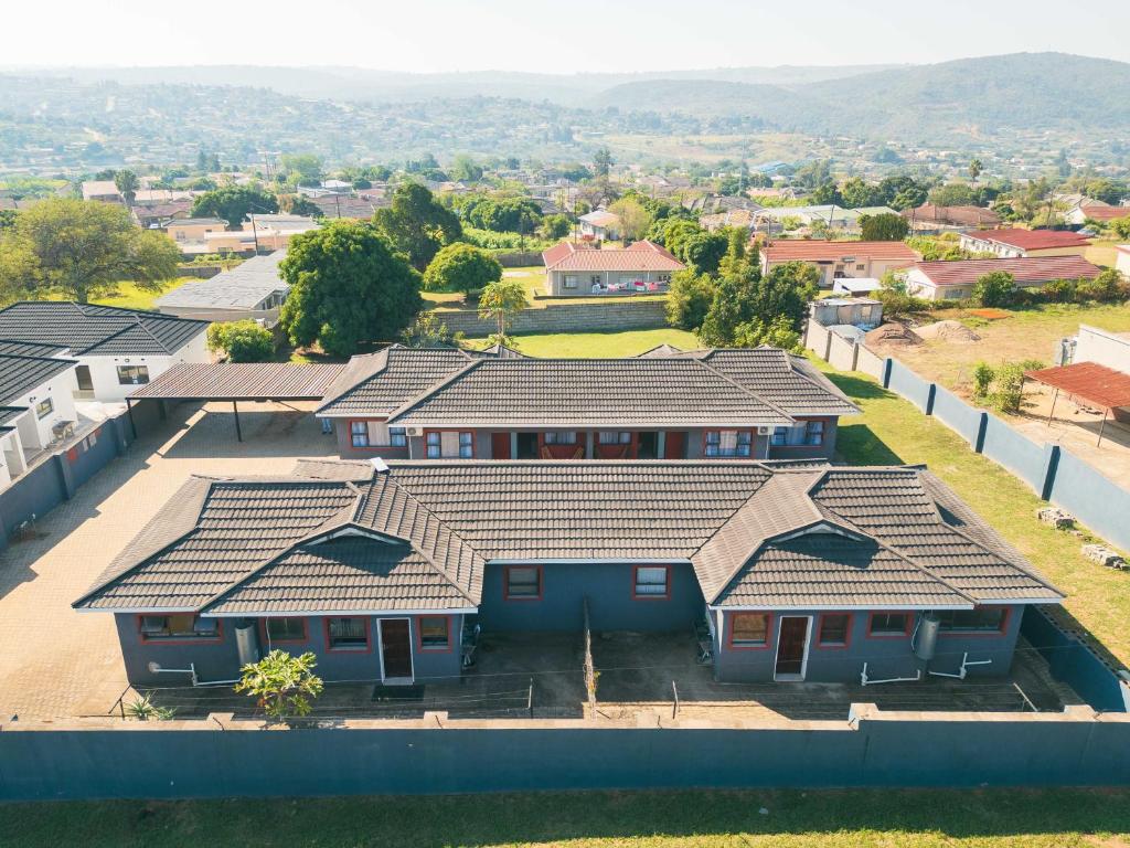 an overhead view of a house with roofs at Trig Beacon in Manzini