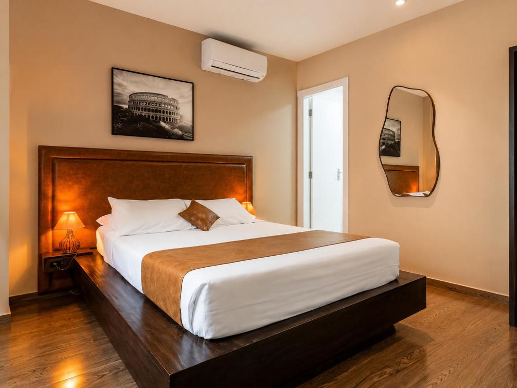 a bedroom with a large bed and a mirror at Bonabrigo Hostel & Suítes in Balneário Camboriú