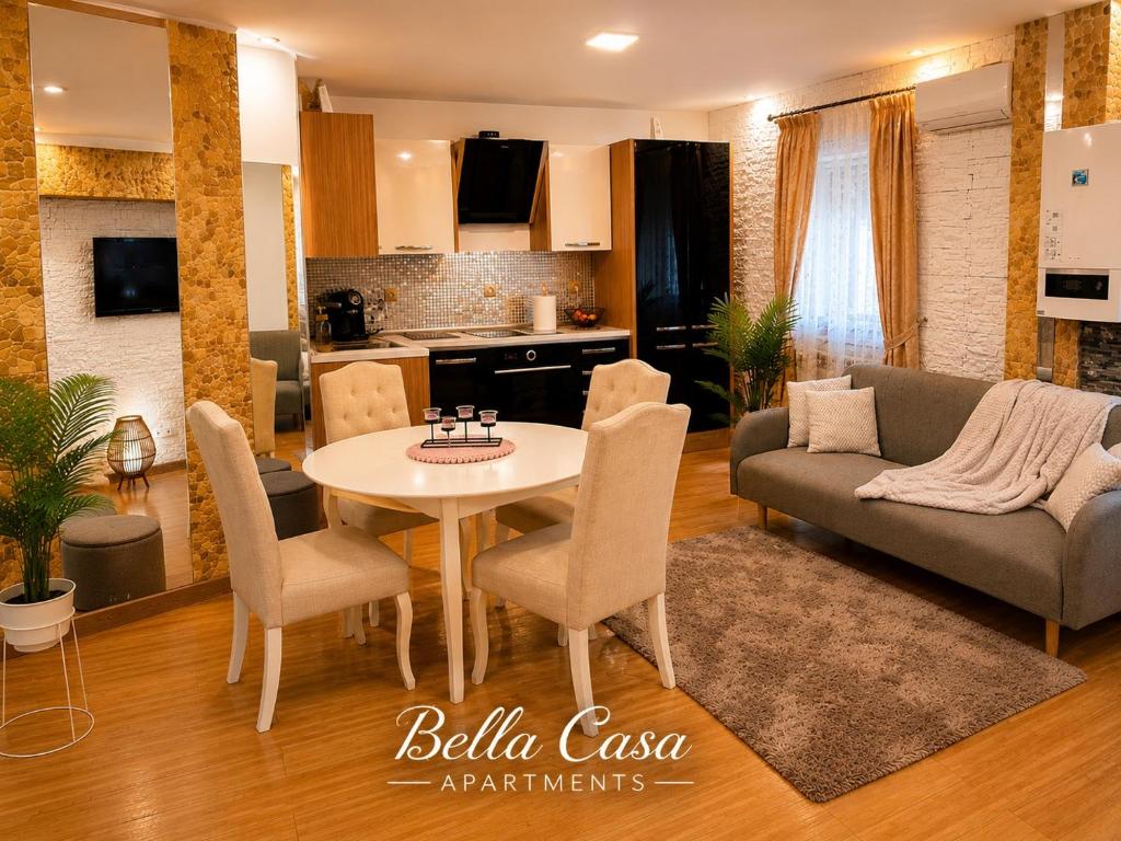 a living room with a couch and a table at Bella Casa Apartments in Făgăraş