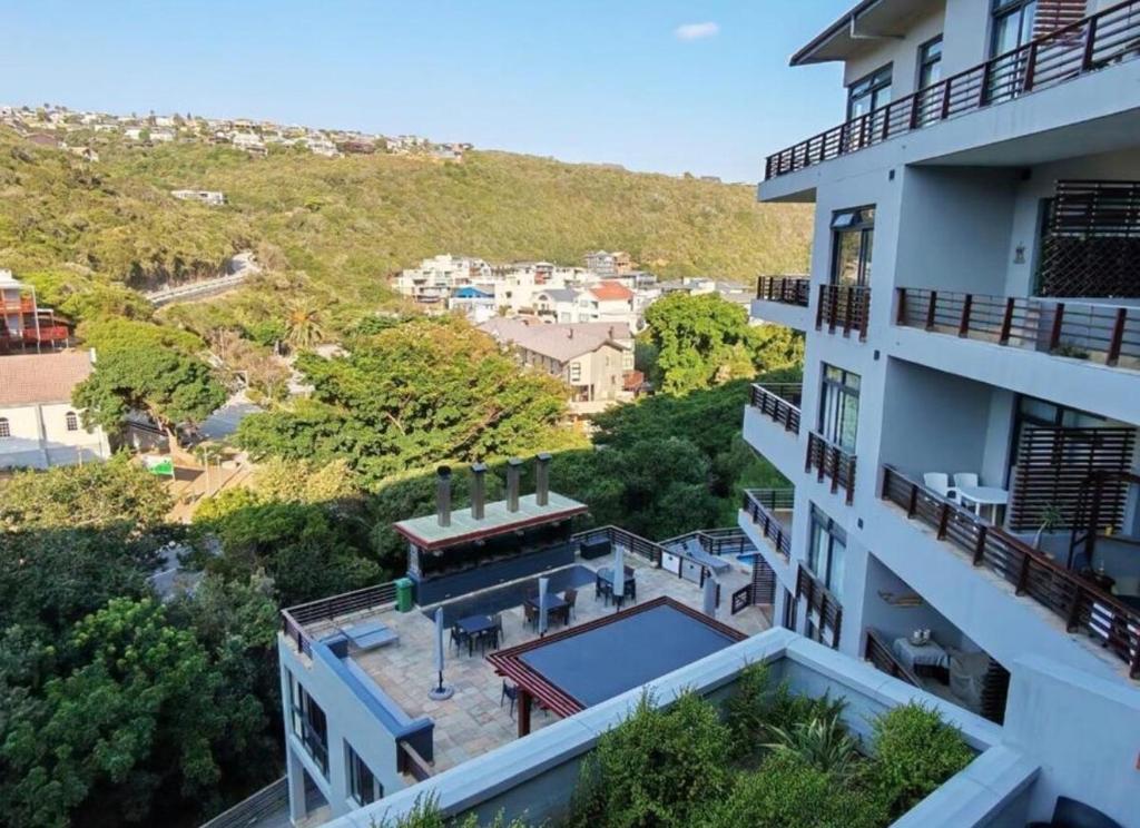 an aerial view of a building with a swimming pool at Stay at the Herold 605 in Herolds Bay