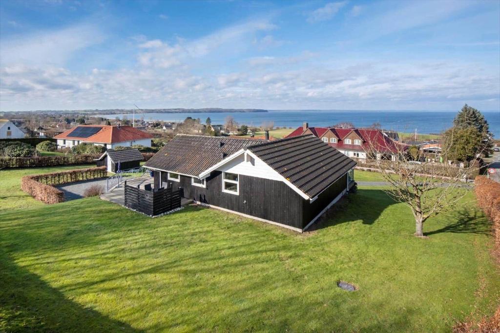 an aerial view of a house on a green field at FY187-Asperup-Bogevangsvej-1 in Asperup