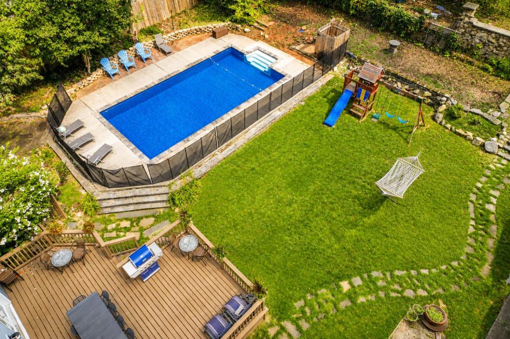 an aerial view of a backyard with a swimming pool at Pool House Near NYC FIFA Stay for Groups in Roselle