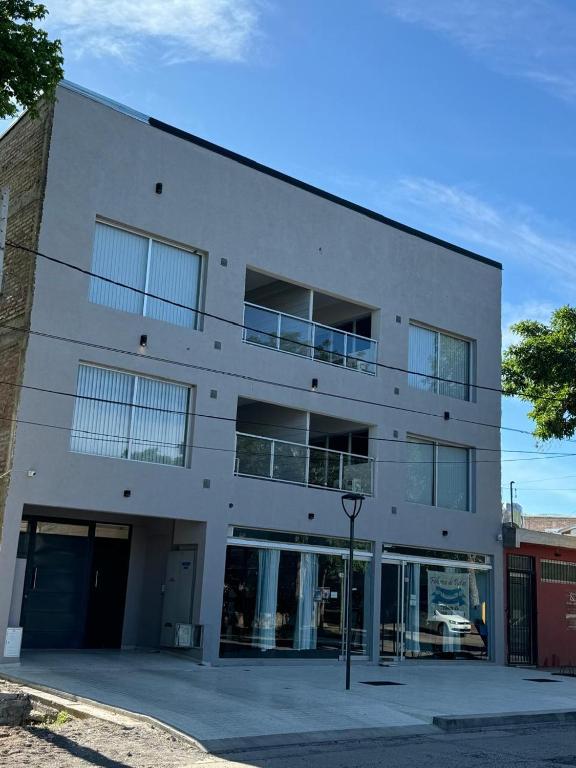 a large white building with a lot of windows at uriburu45 in Malargüe
