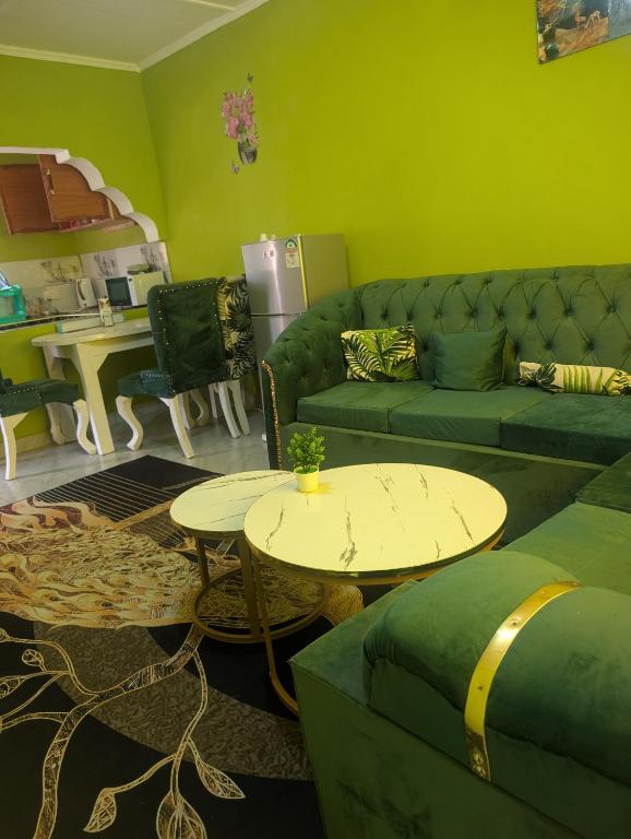 a living room with a couch and a table at ADONAI Homes in Malindi