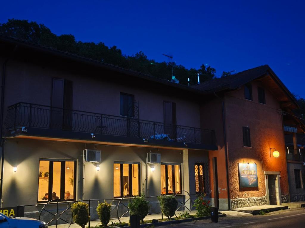 a house at night with its lights on at Hostaria Floow in Avigliana