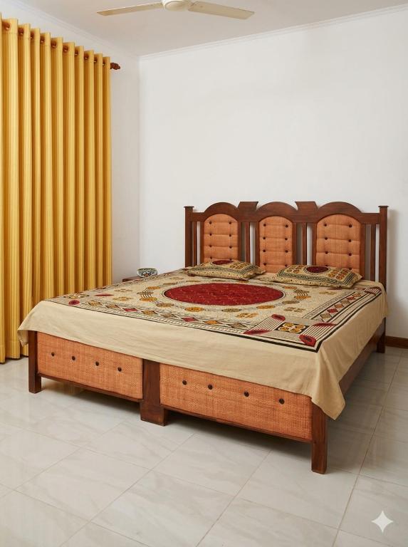 a bedroom with a bed with a wooden bed frame at The White Grand Heritage in Balangoda