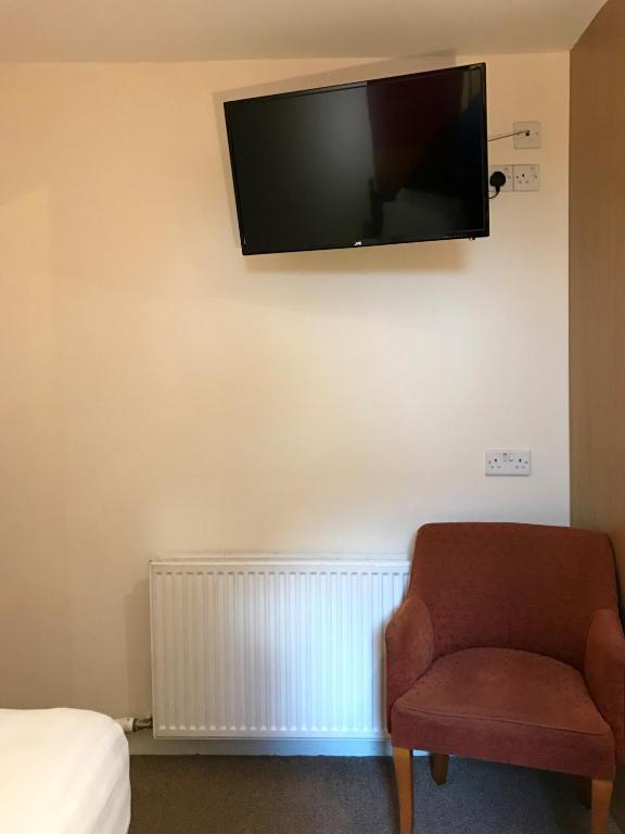TV a/nebo společenská místnost v ubytování Glenlossie Guest House