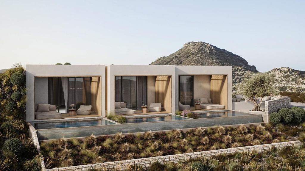 a villa with a view of the mountains at Geomilos Private Suites Milos in Triovasálos