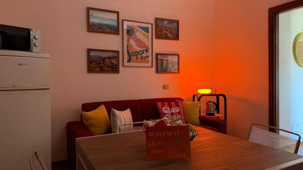 a living room with a couch and a table at Casa Irene in Marina di Massa