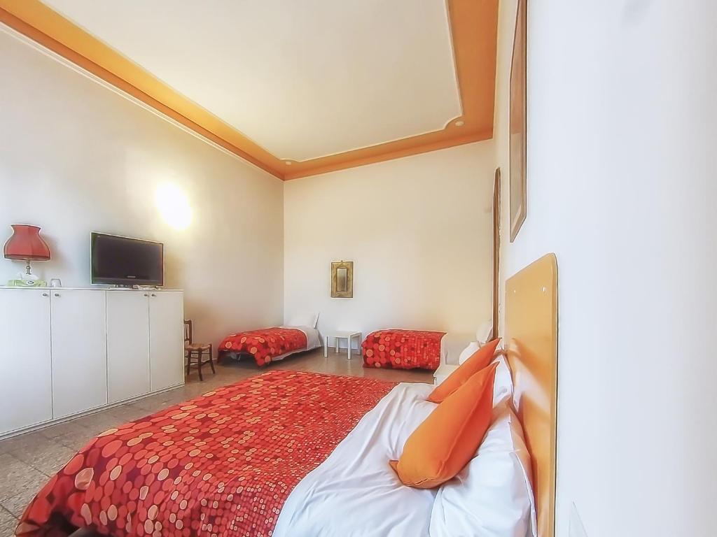 Postel nebo postele na pokoji v ubytování Villa Gini