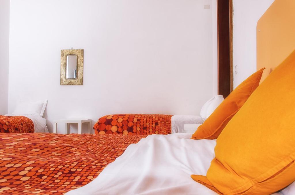 Postel nebo postele na pokoji v ubytování Villa Gini