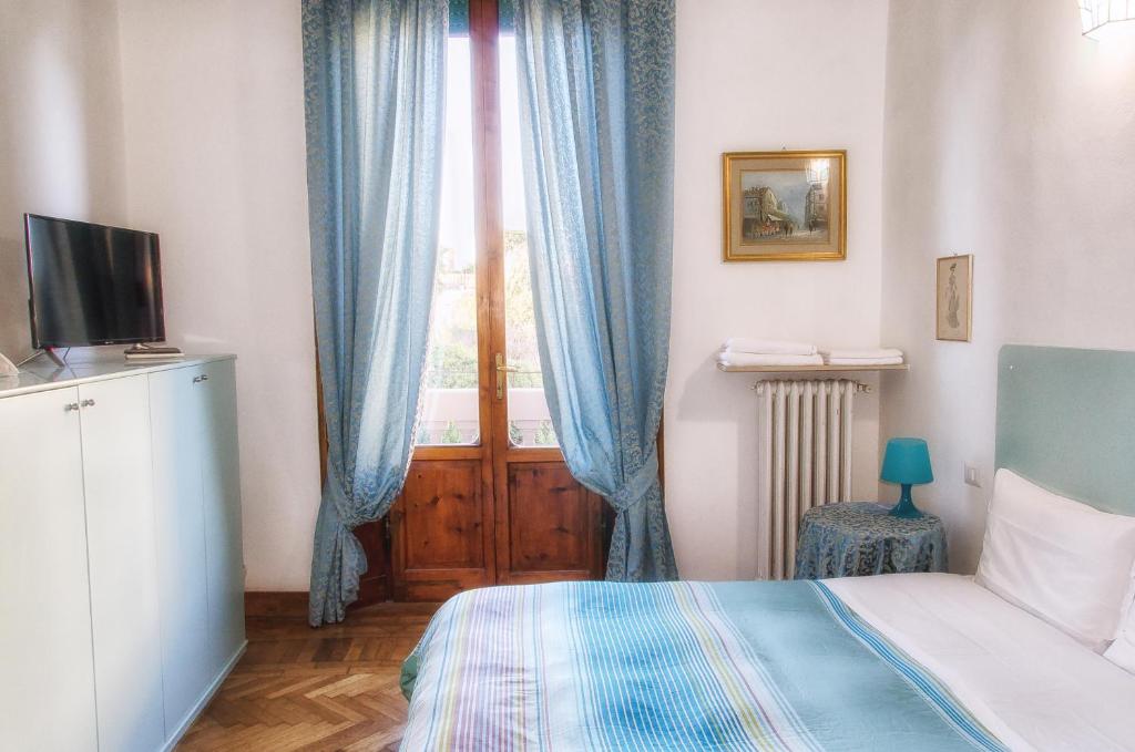 Postel nebo postele na pokoji v ubytování Villa Gini