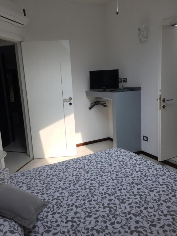 Postel nebo postele na pokoji v ubytování Bella Vita Guesthouse -parcheggio privato interno
